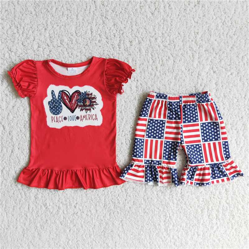 girl red top flags print shorts outfit