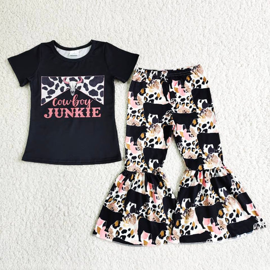 girl black short sleeve outfit with milk cow print