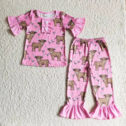 girl pink outfit with cute cow pattern