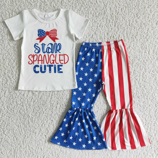 girl July 4th star and stripes print outfit with white short sleeve top and bell pants