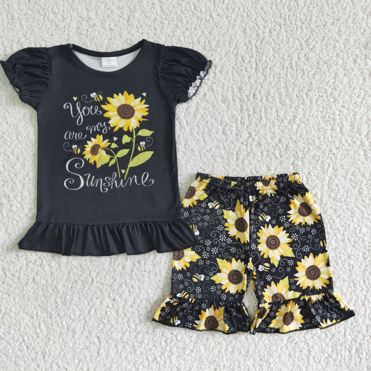 girl summer black puff sleeve top and sunflowers pattern shorts outfit