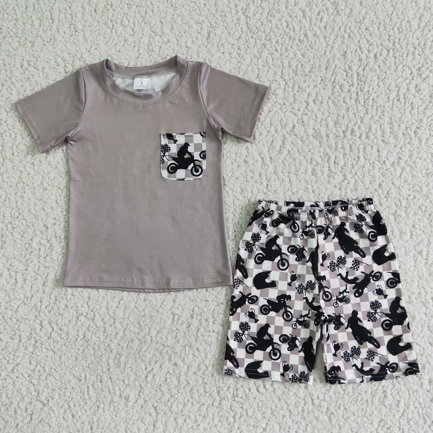 boy ready to ship summer clothes with gray short sleeve shirt and shorts