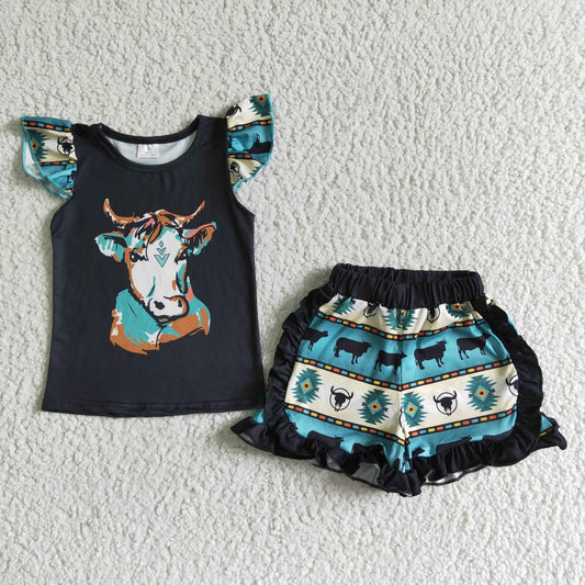 girl flutter sleeve top and cow print shorts with ruffles