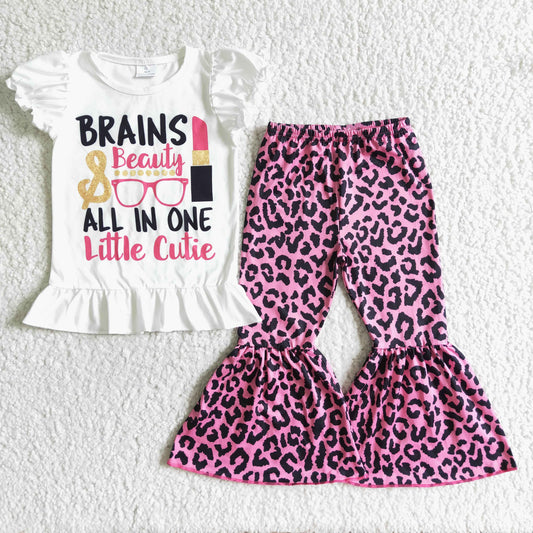 girl white puff sleeve top and pink leopard bell pants outfit